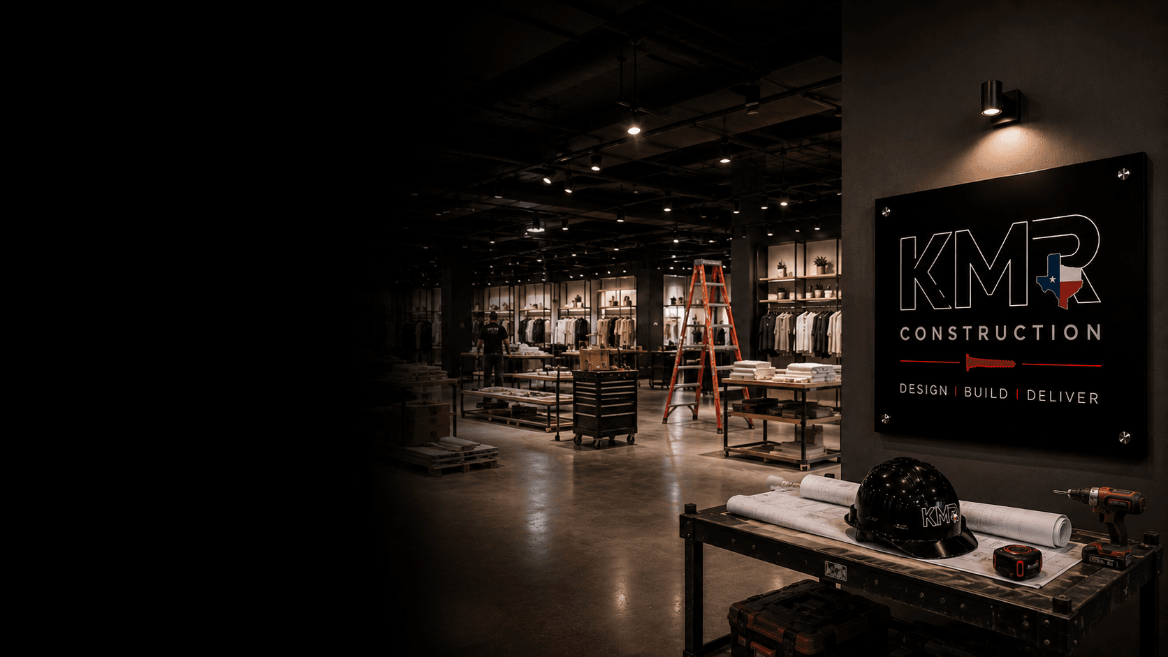 KMR-built retail interior under construction with KMR signage at twilight